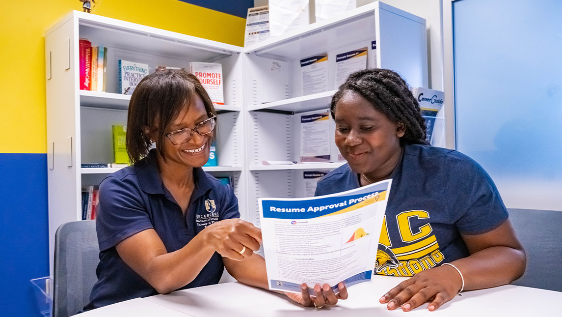 Dr. Hall helping a student with the resume process