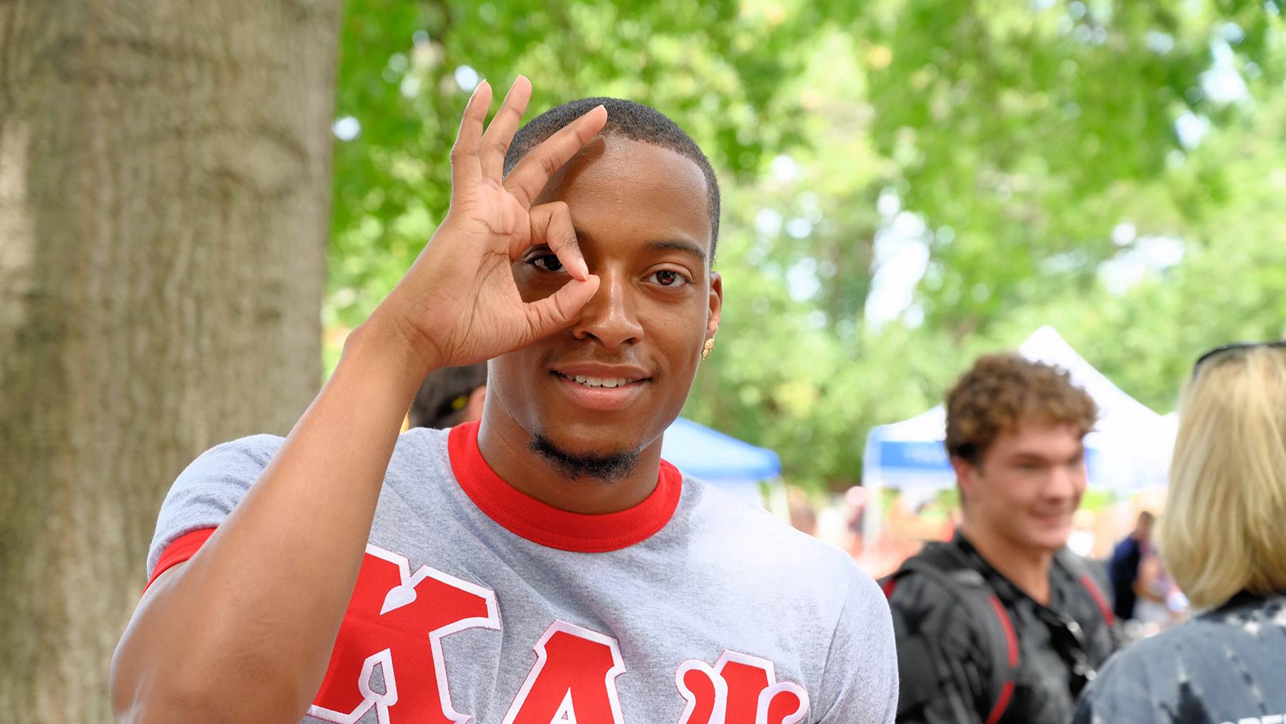 A Kappa Alpha Psi fraternity member poses for a picture.