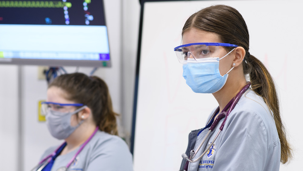 Student nurses in class in the new SIM lab, part of the Nursing & Instructional Building