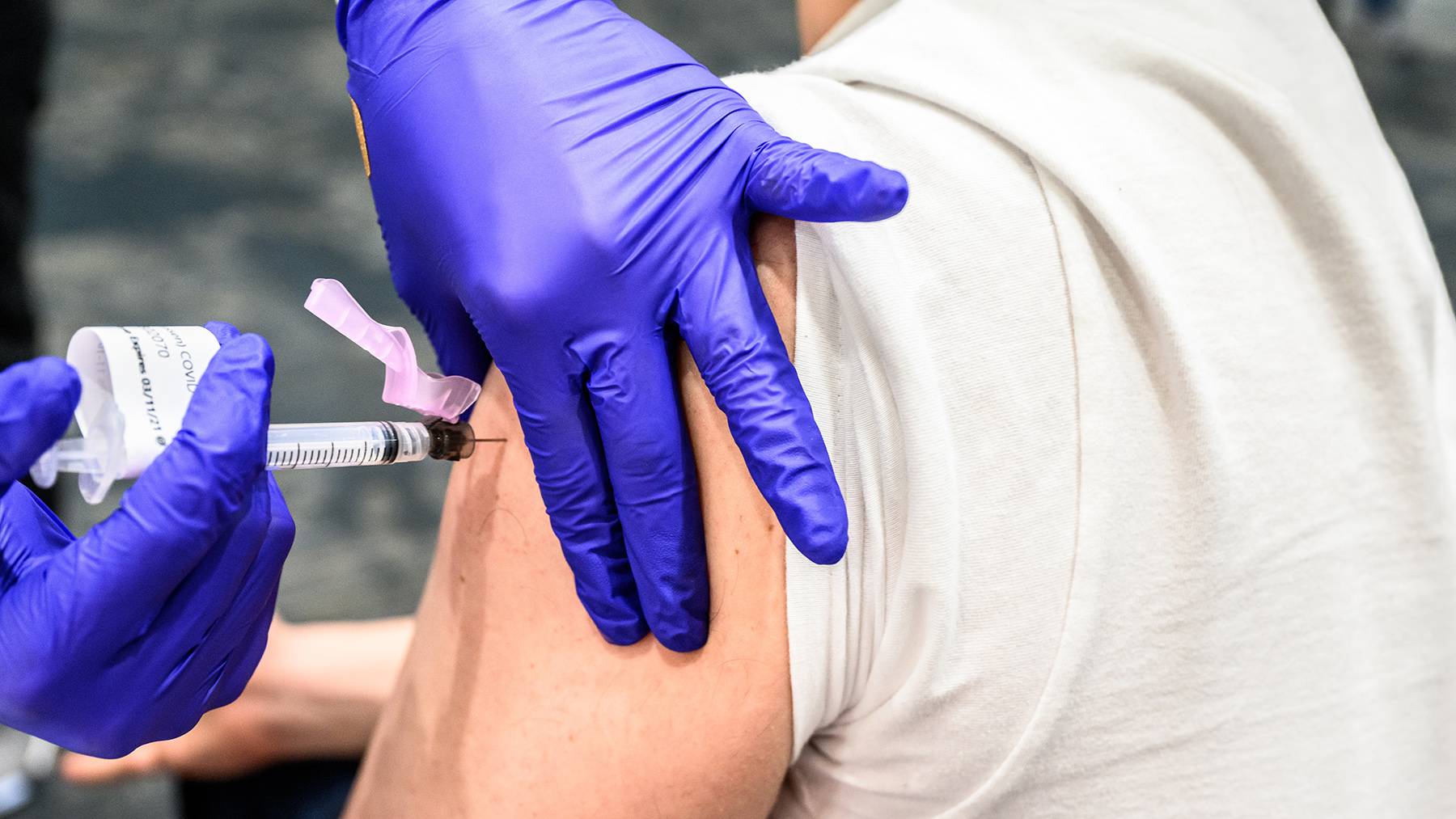 A student receives a COVID-19 vaccine shot at the EUC vaccination clinic.
