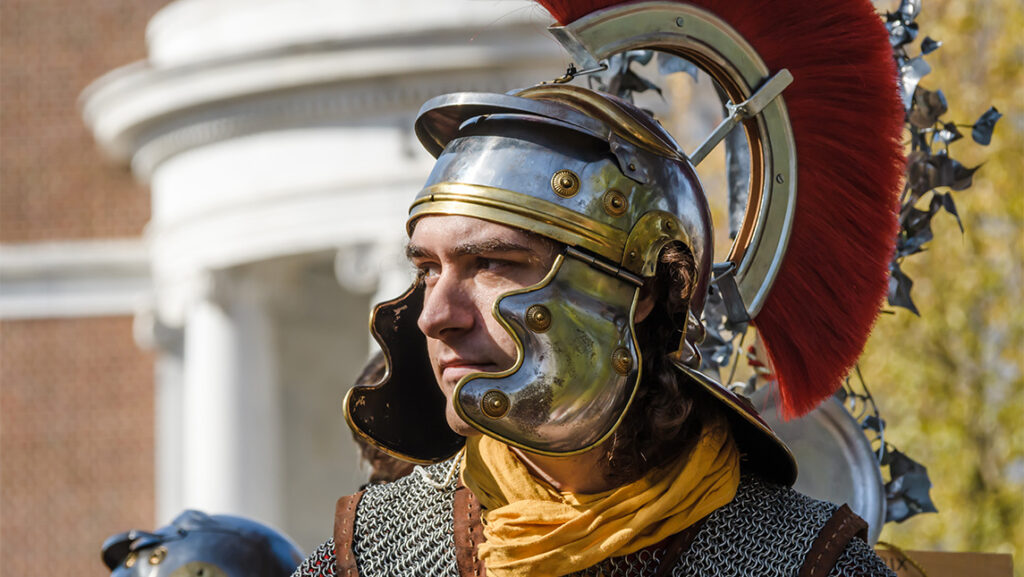 A man dresses as an ancient Roman soldier.