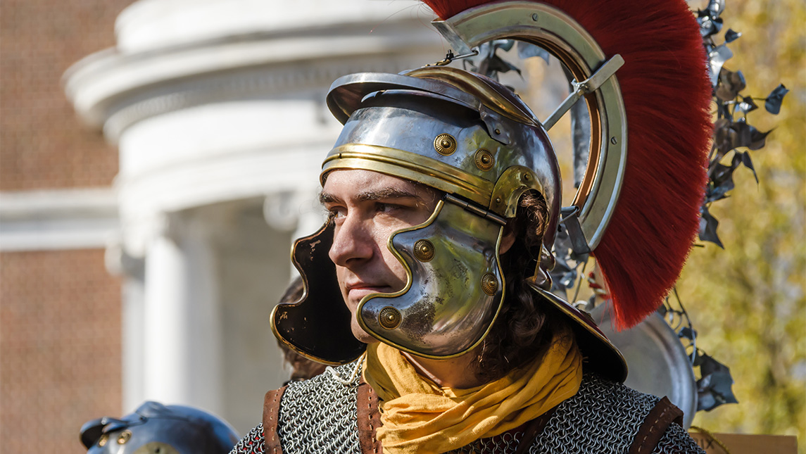 A man dresses as an ancient Roman soldier.