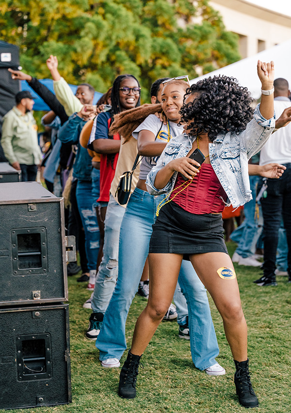 Students dance on the lawn at the 2022 Homecoming.