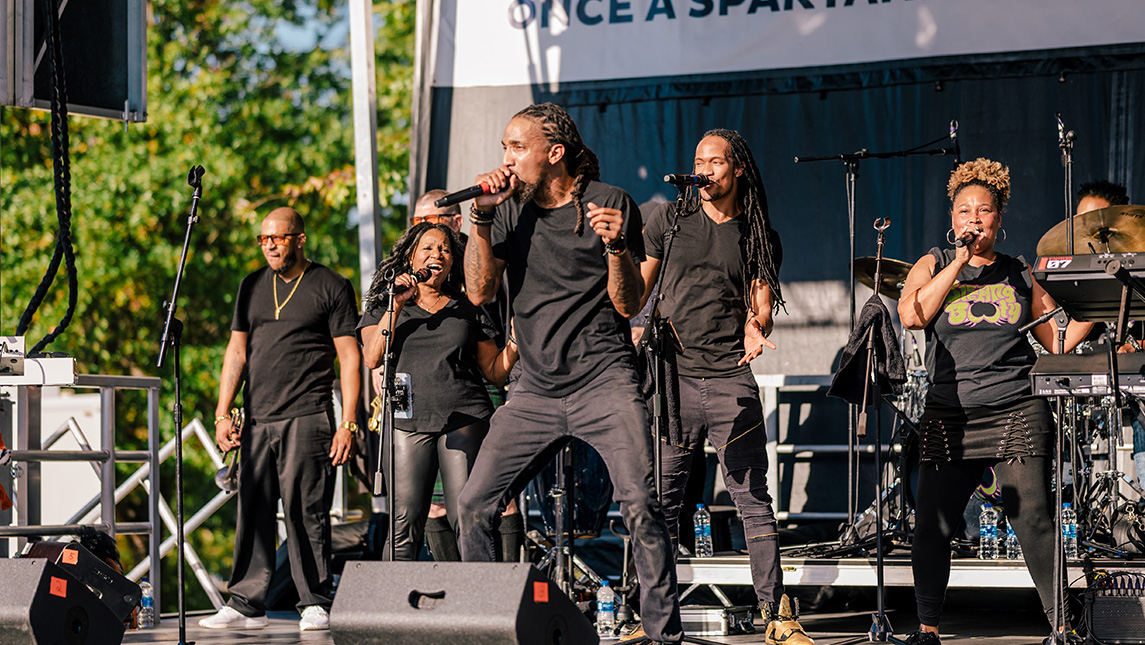 Musicians perform on outdoor stage at 2022 Homecoming.