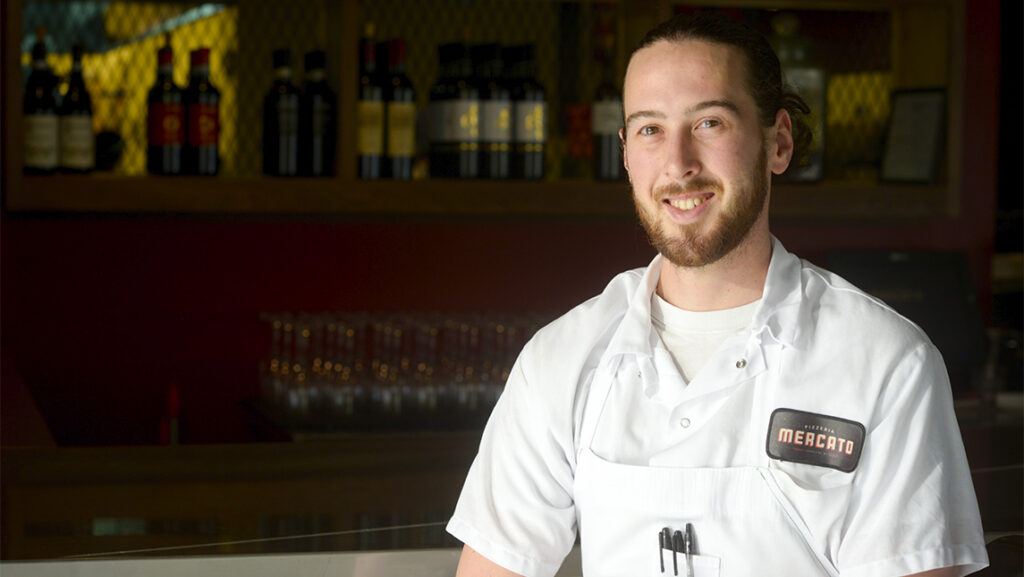 Gabe Barker, BA '10, at his restaurant Pizzeria Mercato in Carrboro, NC.
