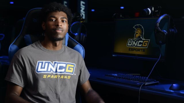Photo of UNCG student Morgan Atwater with UNCG Esports tshirt