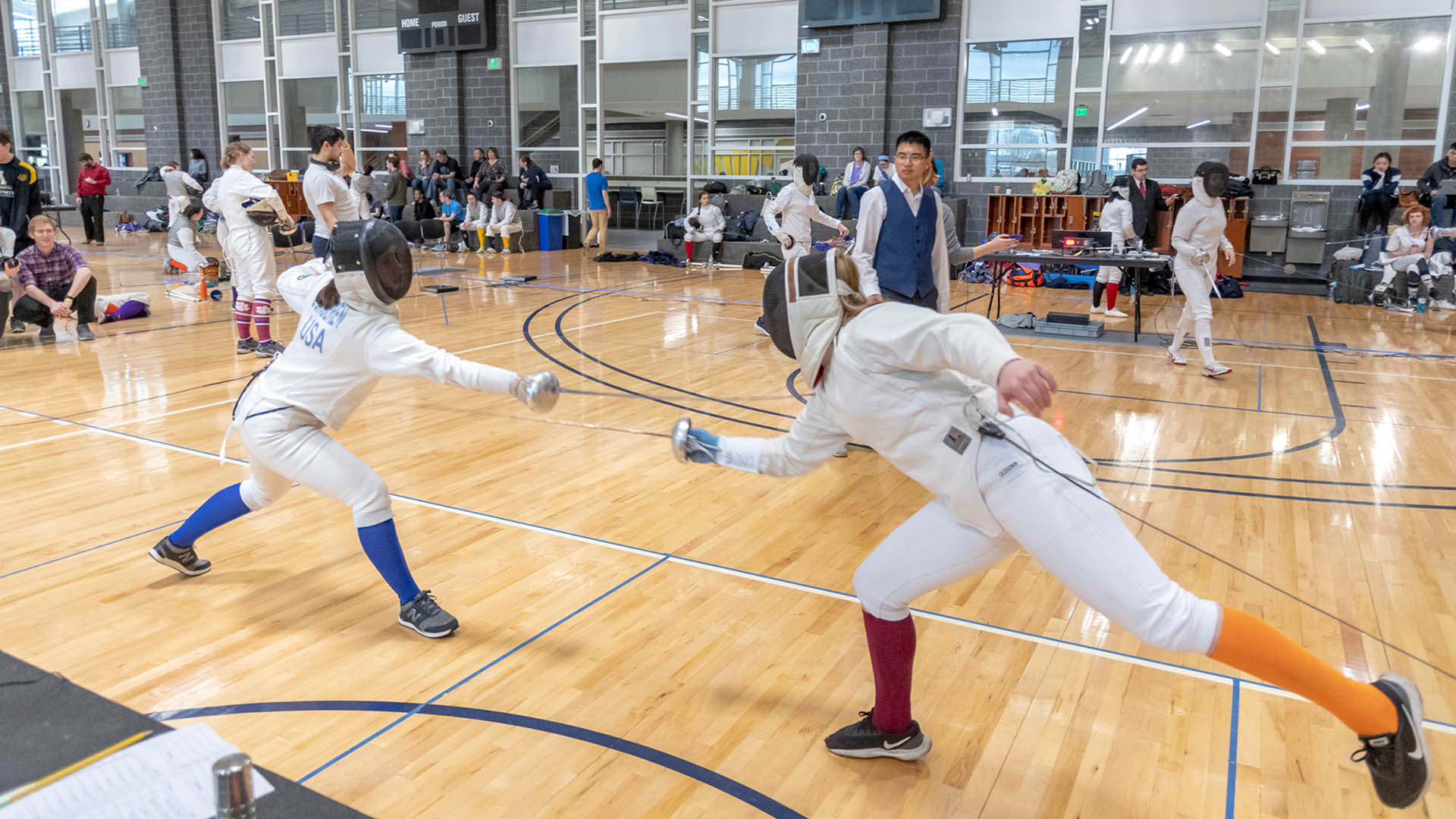 Collegiate club teams compete in a fencing tournament at the Kaplan Center.