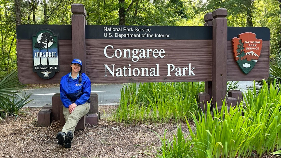 Tatiana poses in front of the Congaree National Park sign