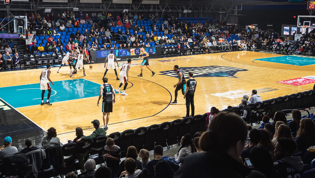 Swarm basketball players in the middle of a game.