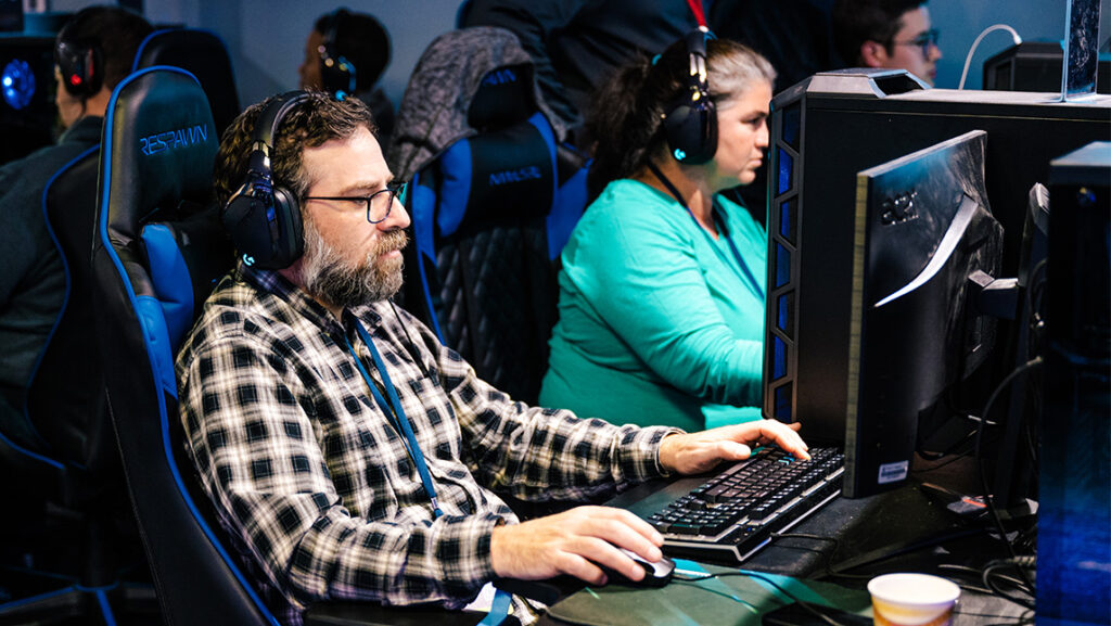 Faculty work with the Unreal engine in the Esports Center.