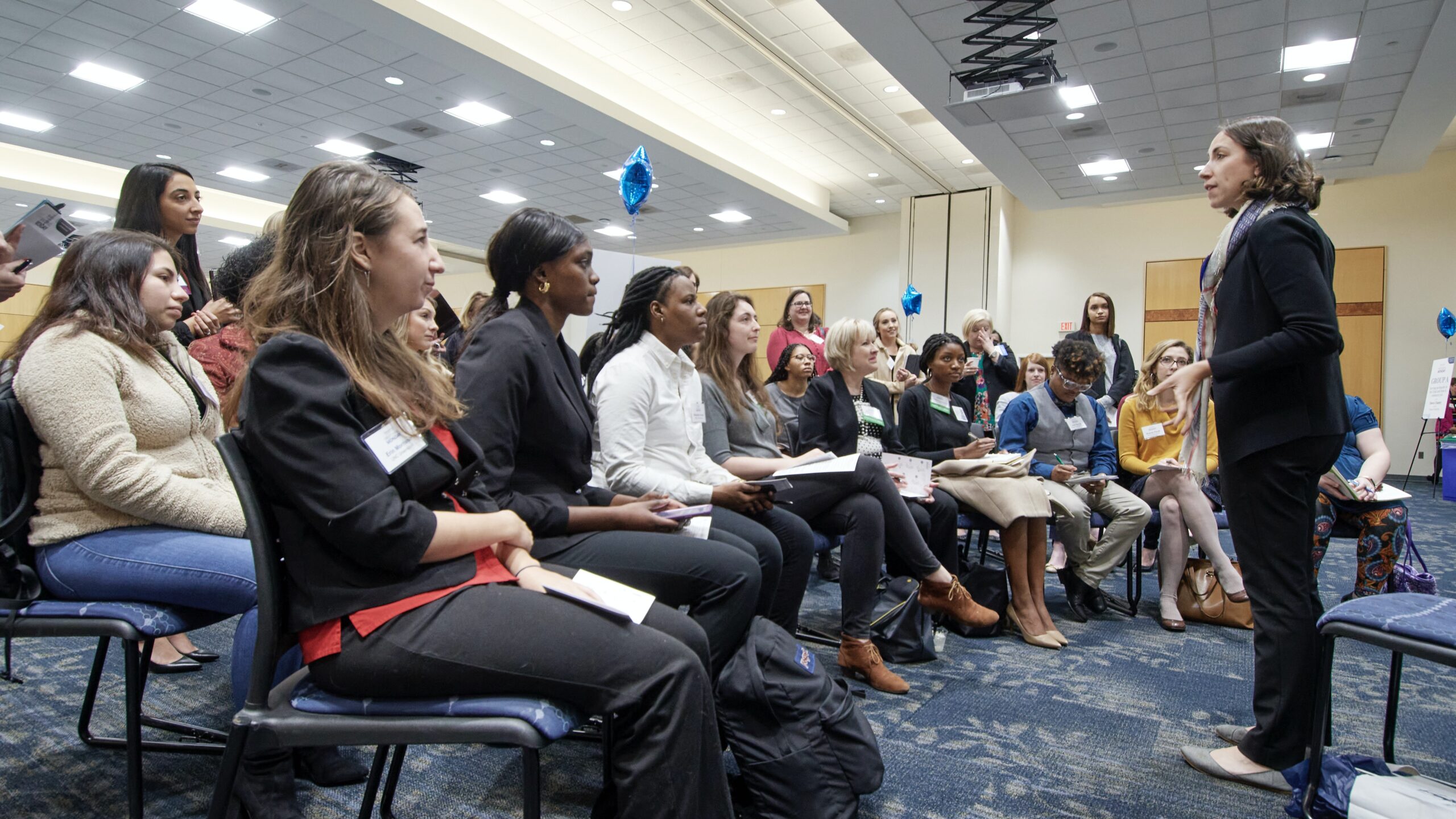 Participants listening to a presentation for Mentoring Monday event. 