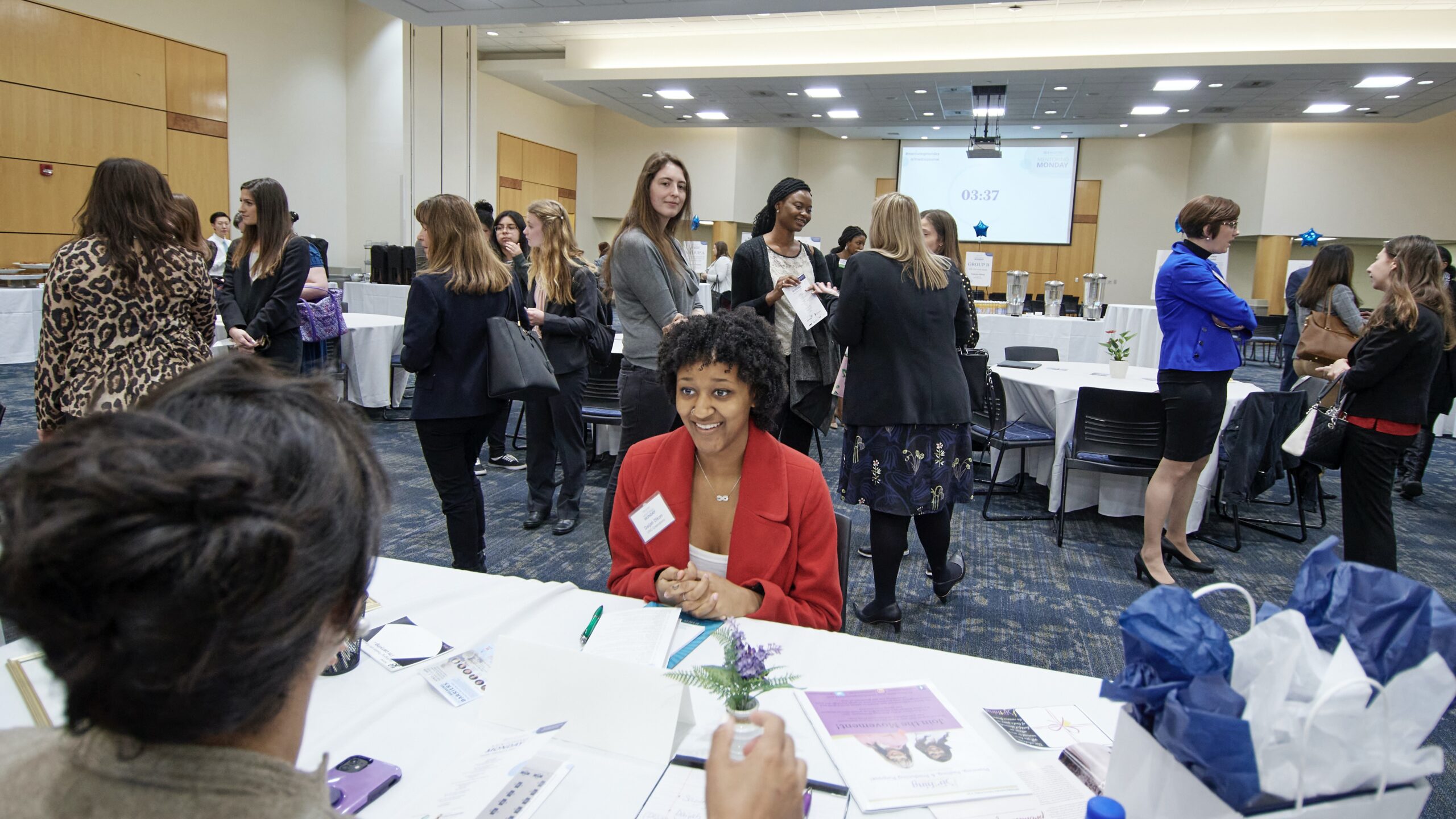 A UNCG student having a conversation with a mentor during Mentoring Monday event. 