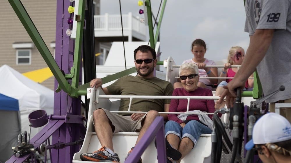 Phil on ferris wheel with grandmother.