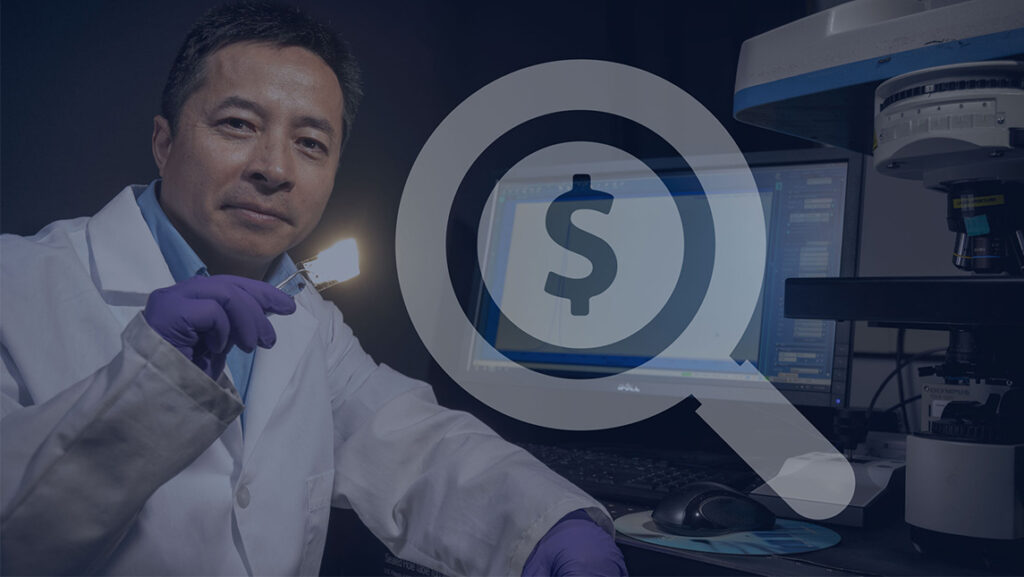 Dr. Jianjun Wei holds a heart biosensor.