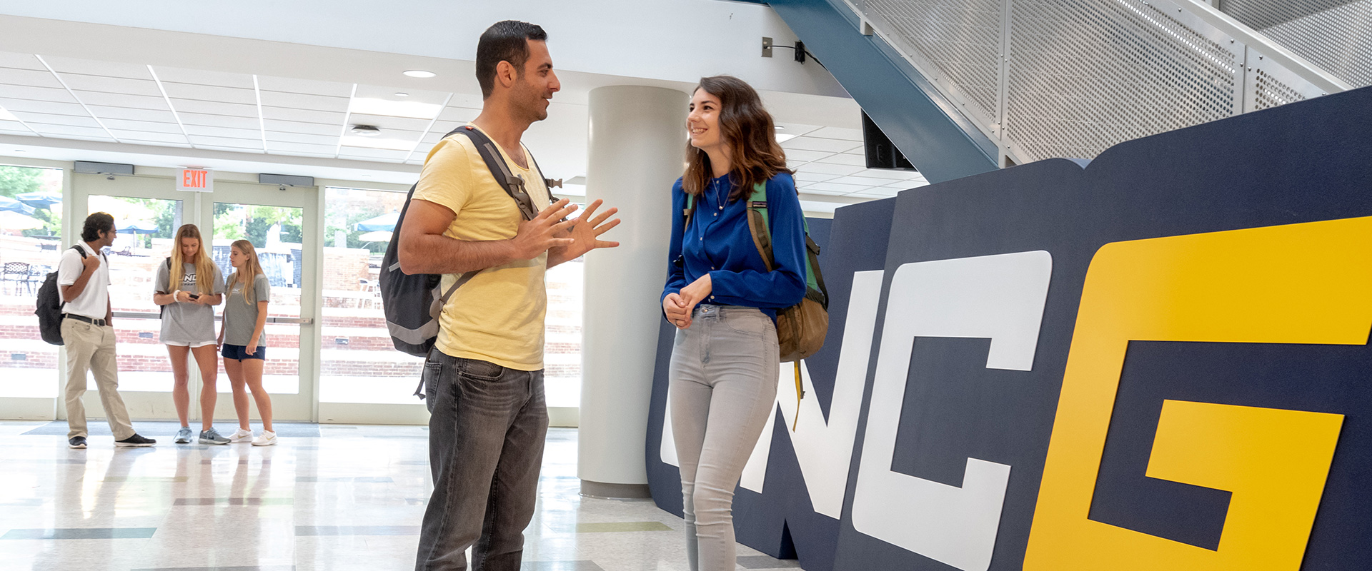 Students chatting in Moran Commons at UNCG.