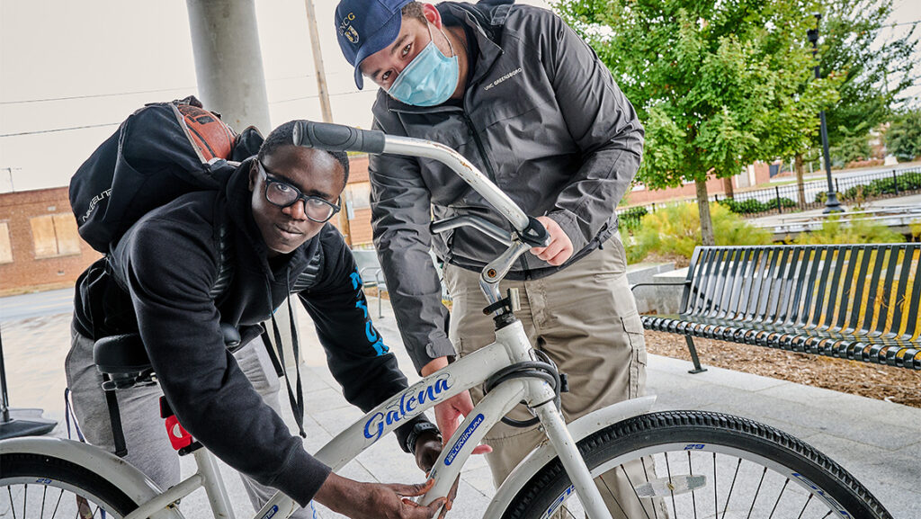 A student gets maintenance done on his bike.