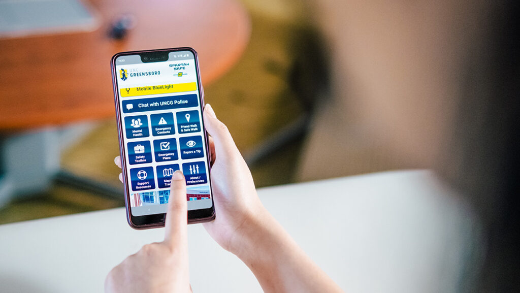 A phone has the Spartan Safe mobile app.