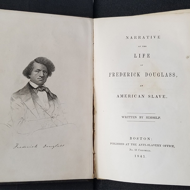 Close-up of a very old and weathered title page of "Life of Fredrick Douglass" with publishing date of 1864.