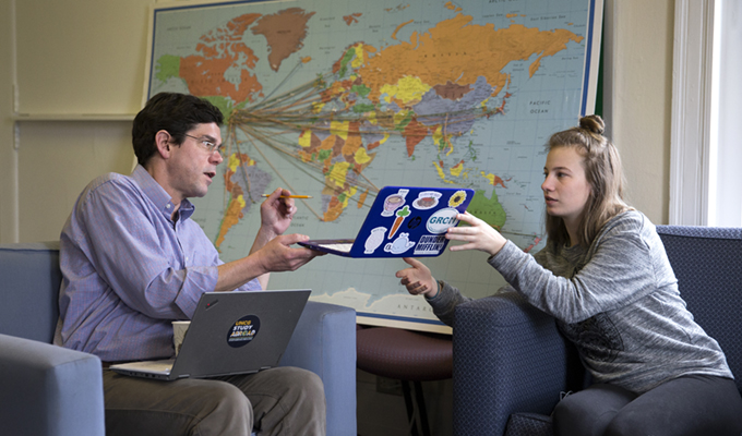 om Martinek, Jr., Director of Study Abroad and Exchange Programs works with Katie White, a freshman education major, planning her academic program for study