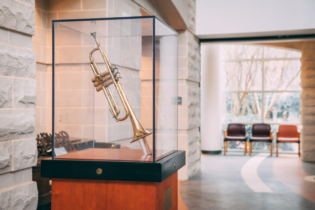 Shot featuring the Miles Davis' trumpet on display in the music building.