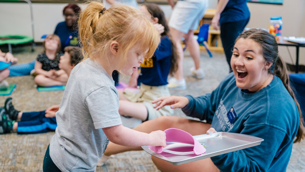 A young girls plays in camp.