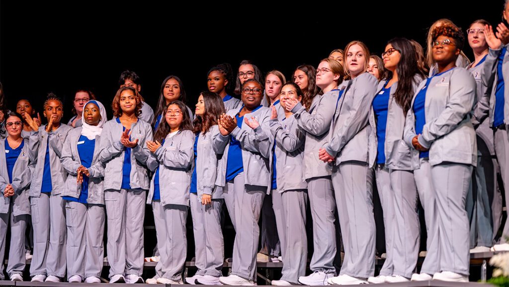 Nursing students celebrate at UNCG's graduation ceremony.