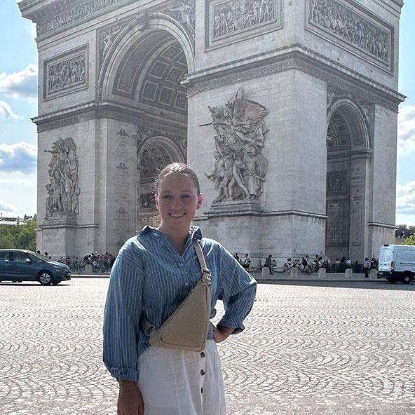 UNCG biology student, Allison Hughes, in front of Arc de Triomphe