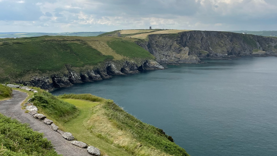 Golf course in Ireland with cliffs dropping into ocean.