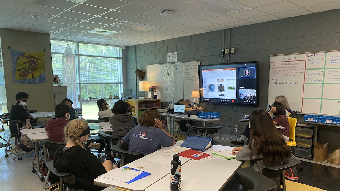 High school students remote learning SEM session in a classroom setting.