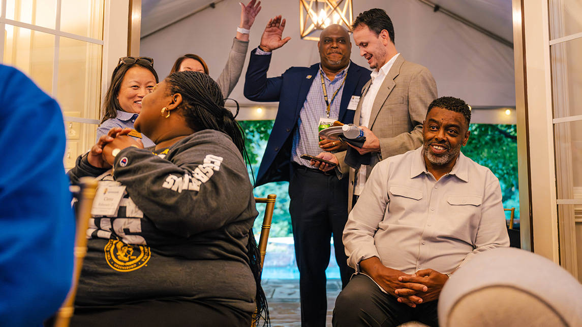 UNCG Chancellor Gilliam plays trivia with students.