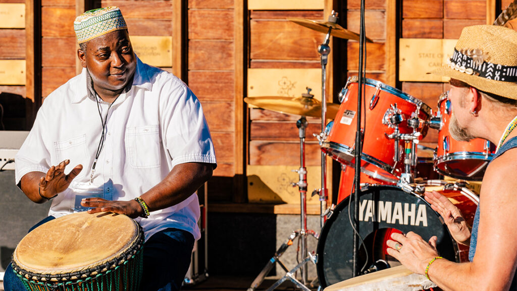 A man plays the drums.