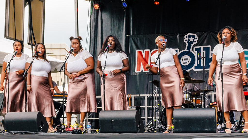A group of singers onstage.