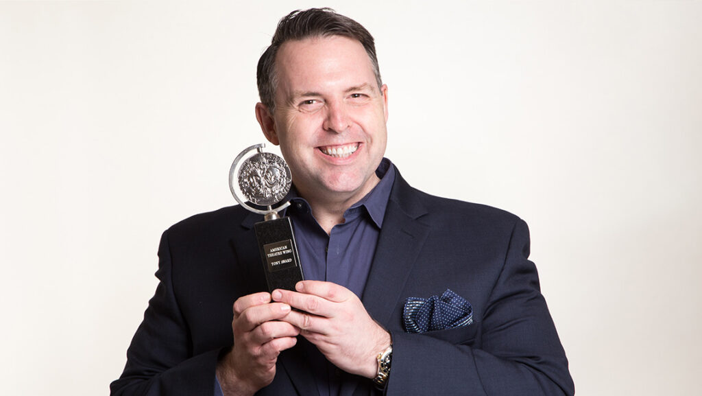 UNCG School of Theatre Professor Hugh Hysell holds a Tony Award