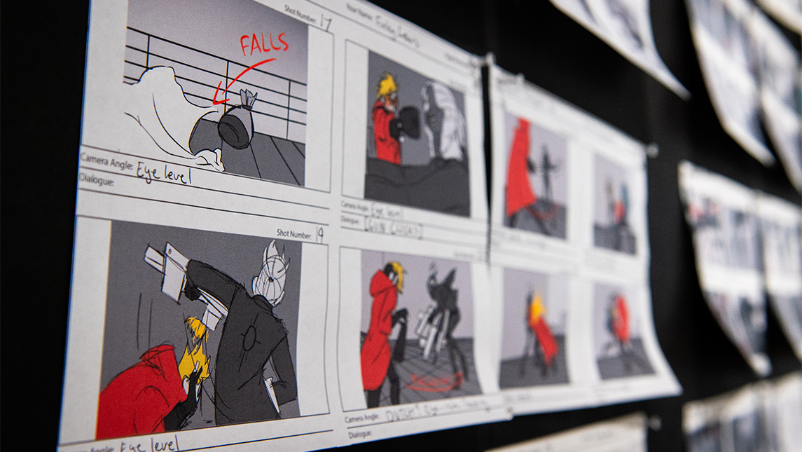 Storyboards by UNCG art students on display.