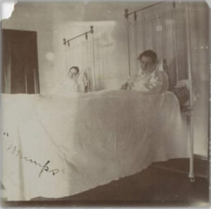 Black and white photo of UNCG students in the infirmary during a typhoid outbreak.