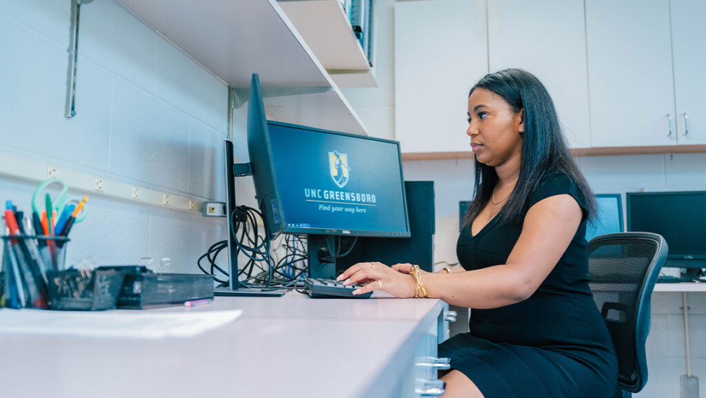 Williams at a computer keyboard.