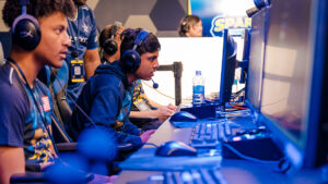 Video gamers focus on their screens in the UNCG esports arena.