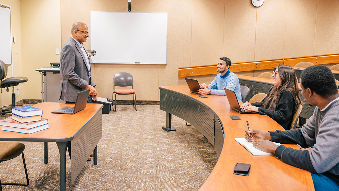 Dr. Prashant Palvia speaks to students in a UNCG classroom.
