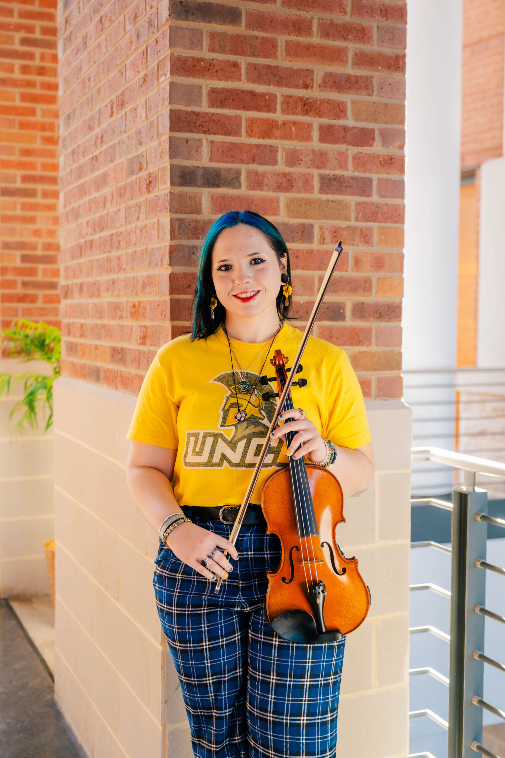 Elena Cousin holding violin.