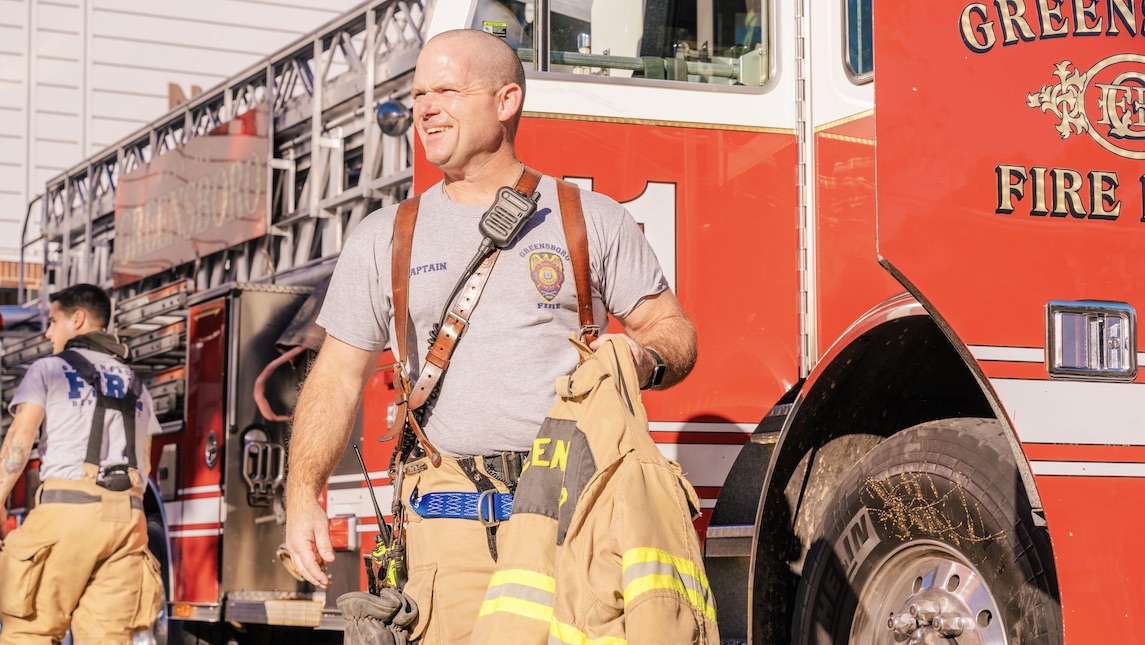 Bryan School graduate Nick Loflin dressed in his work gear for the Greensboro Fire Dept.