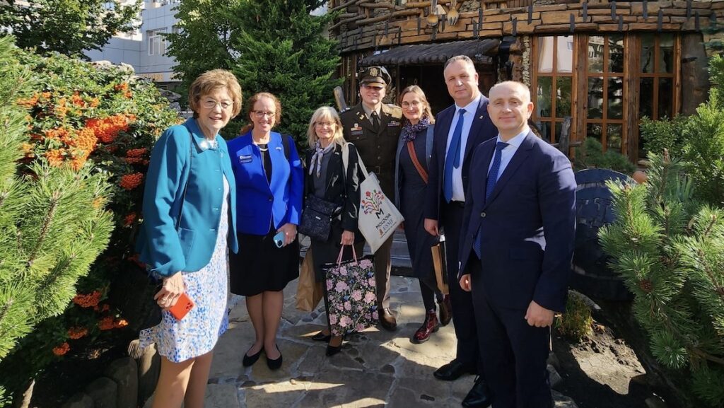 Synder with Secretary of State Elaine Marshall in Moldolva.