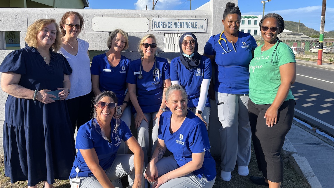 Audrey Synder poses with Faculty and students at Nightingale Ave in St. Kitts.