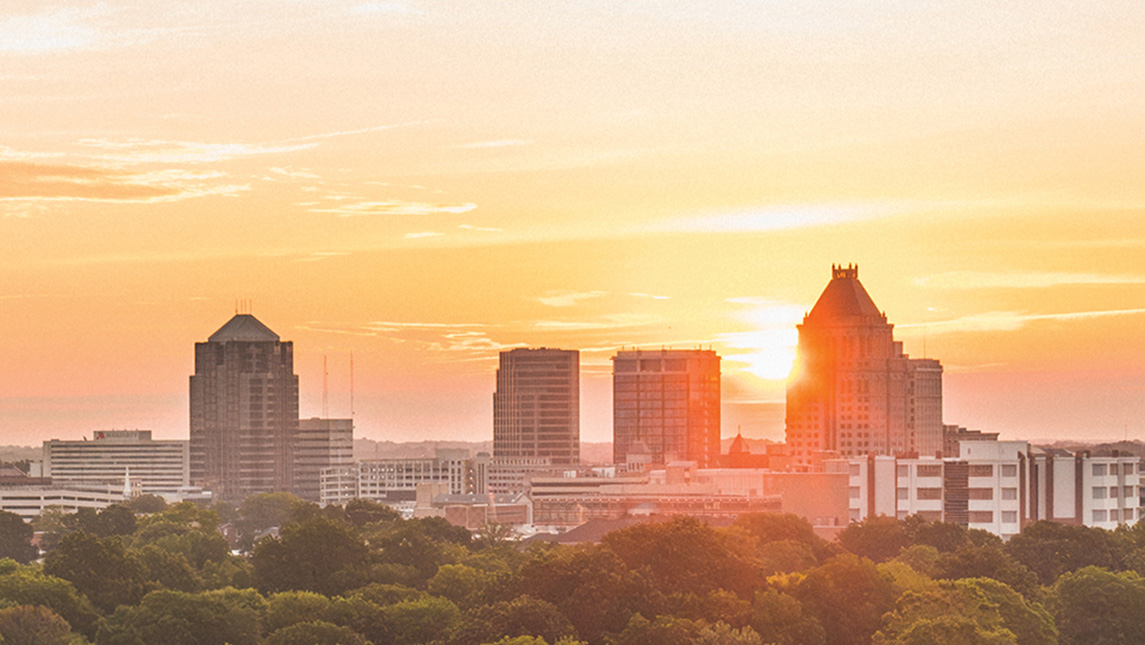 Sunrise over the Greensboro skyline from direction of UNCG.
