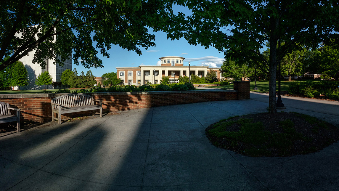 Shady path outside the UNCG Elliott University Center (EUC).