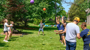 UNCG employees throw kickballs on Employee Field Day.
