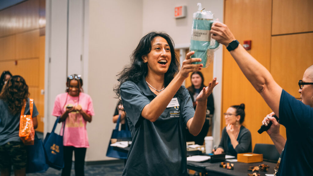 UNCG student receives a prize the September 2023 Be Well, Stay Well event