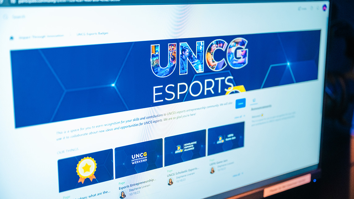 A browser on a computer screen with a blue banner and the text that reads UNCG esports.