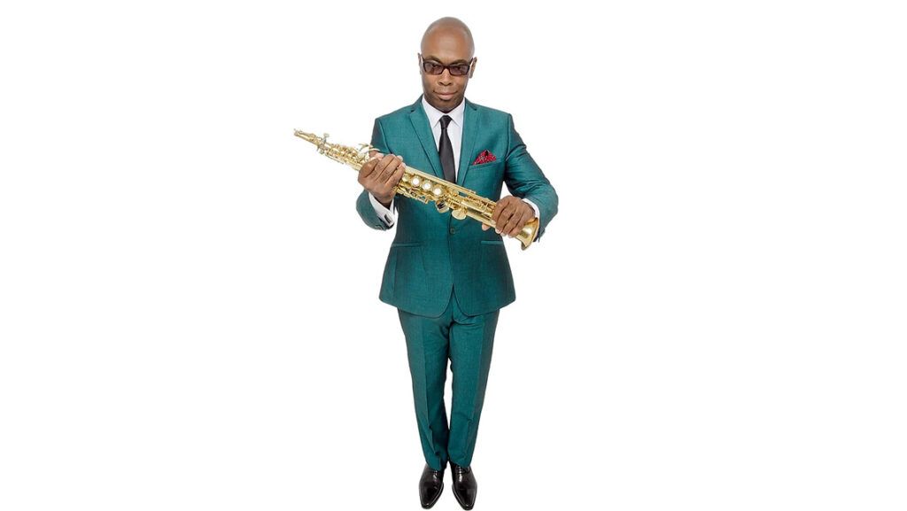 Tim Warfield holds a saxophone