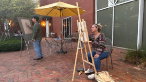 UNCG art students draw in Weatherspoon courtyard.