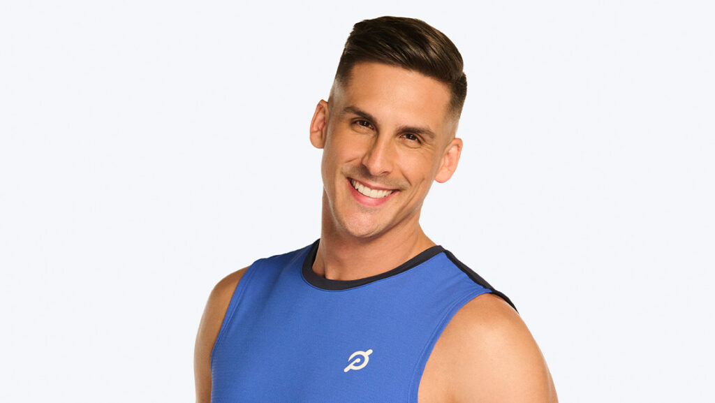 UNCG alum Cody Rigsby smiles in Peloton gear